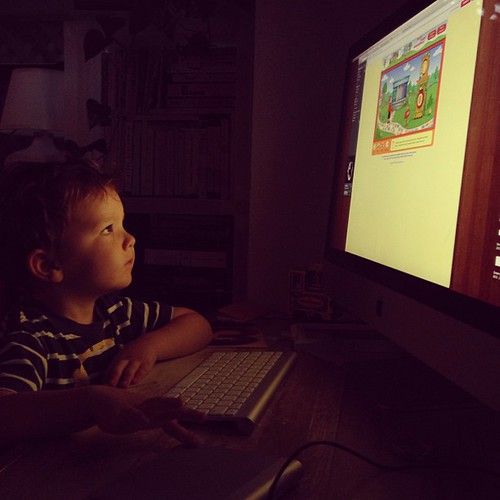 Niko masters the track pad in order to play the Mr. Rogers flash trolley game.