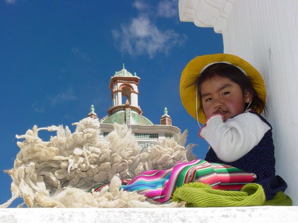 Young Girl with Wool in Niche of Cathedral Wall - Copacabana - Bolivia