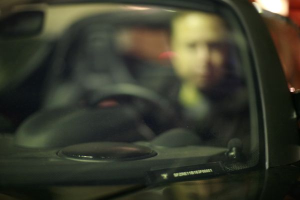 Elon Musk, Tesla Chairman, through windshield of first production Tesla