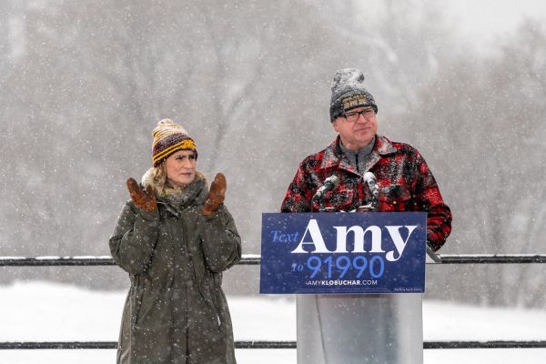 Minnesota Governor Tim Walz and Lieutenant Governor Peggy Flanagan speak before Senator Amy Klobuchar takes the stage to