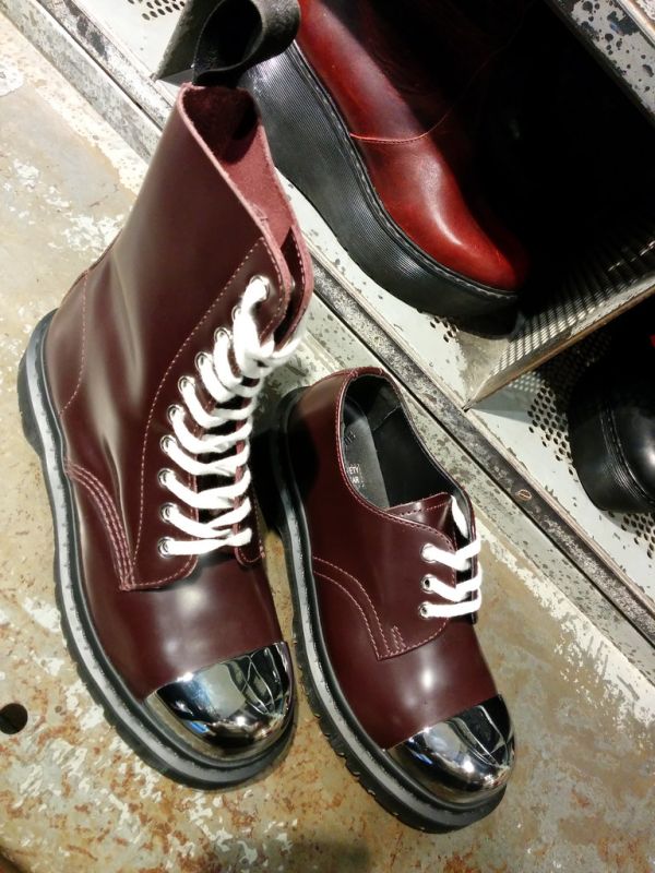 Shiny steel capped Docs, Doctor Marten's store, Neal Street, Covent Garden, London, UK