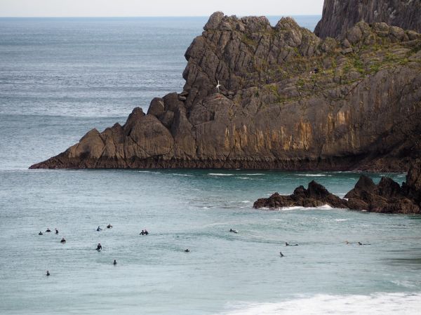 Surfers at Laga Beach, Basque Country