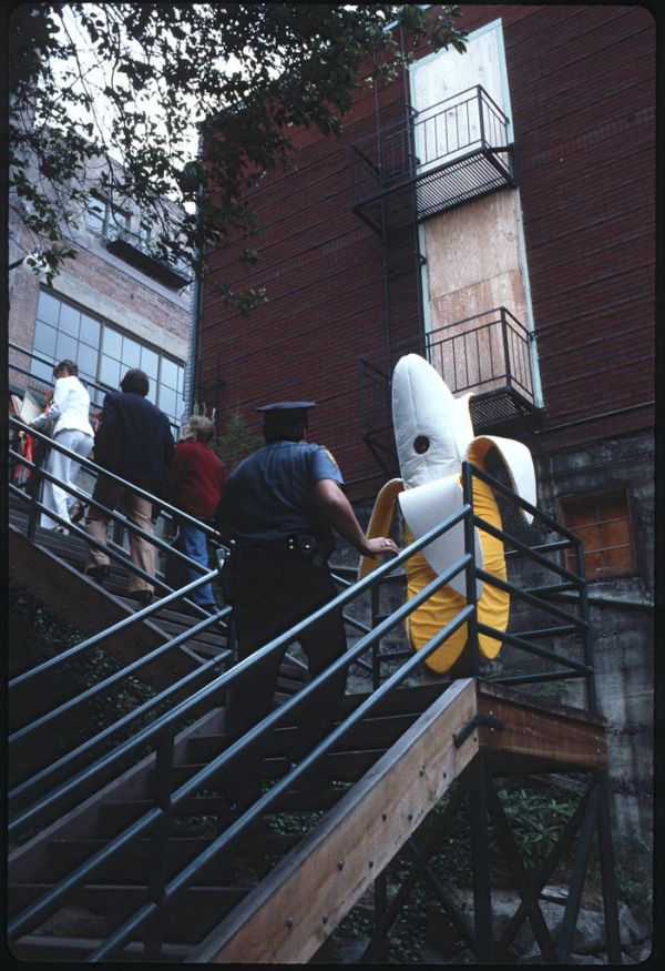 Policeman and banana on Pike Place Market stairway, 1978