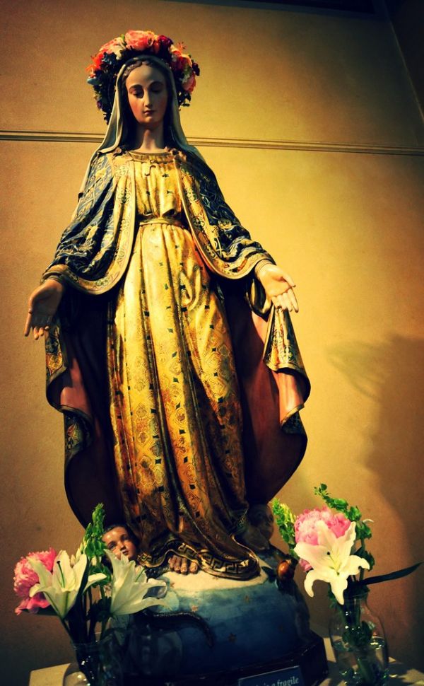 Statue of Mary of Miracles, golden gown, angel, lilies, Brenda Bentz's funeral, St. James Cathedral, Catholic Church, Fi