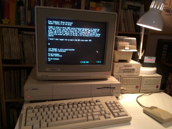 Amiga 1000 connected to an Apple IIgs-hosted BBS via telnet