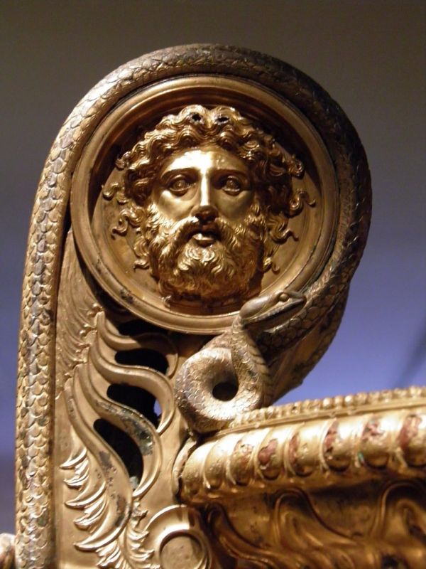 The Derveni krater, late 4th century B.C., Snake framing the rising handle and wrapping their bodies around a mask of an