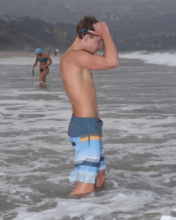 Teen In Boardshorts Acclimates