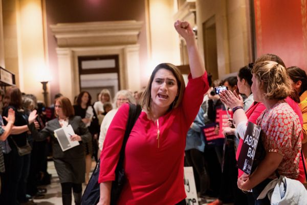 Minnesota Representative Peggy Flanagan heads in to vote on HF812 which would affect women's reproductive rights in Minn